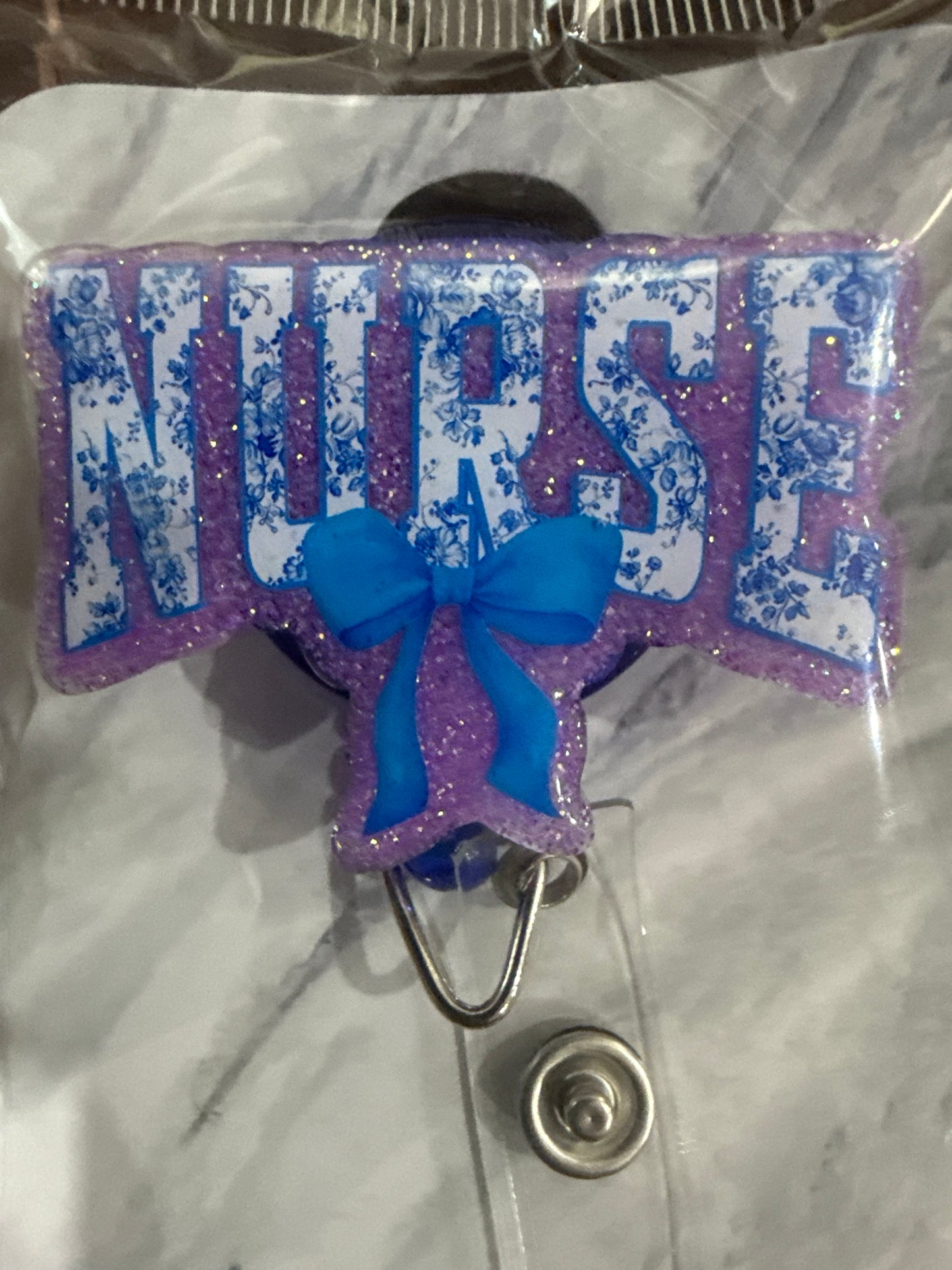 RTS - Blue "NURSE" with bow Badge Reel