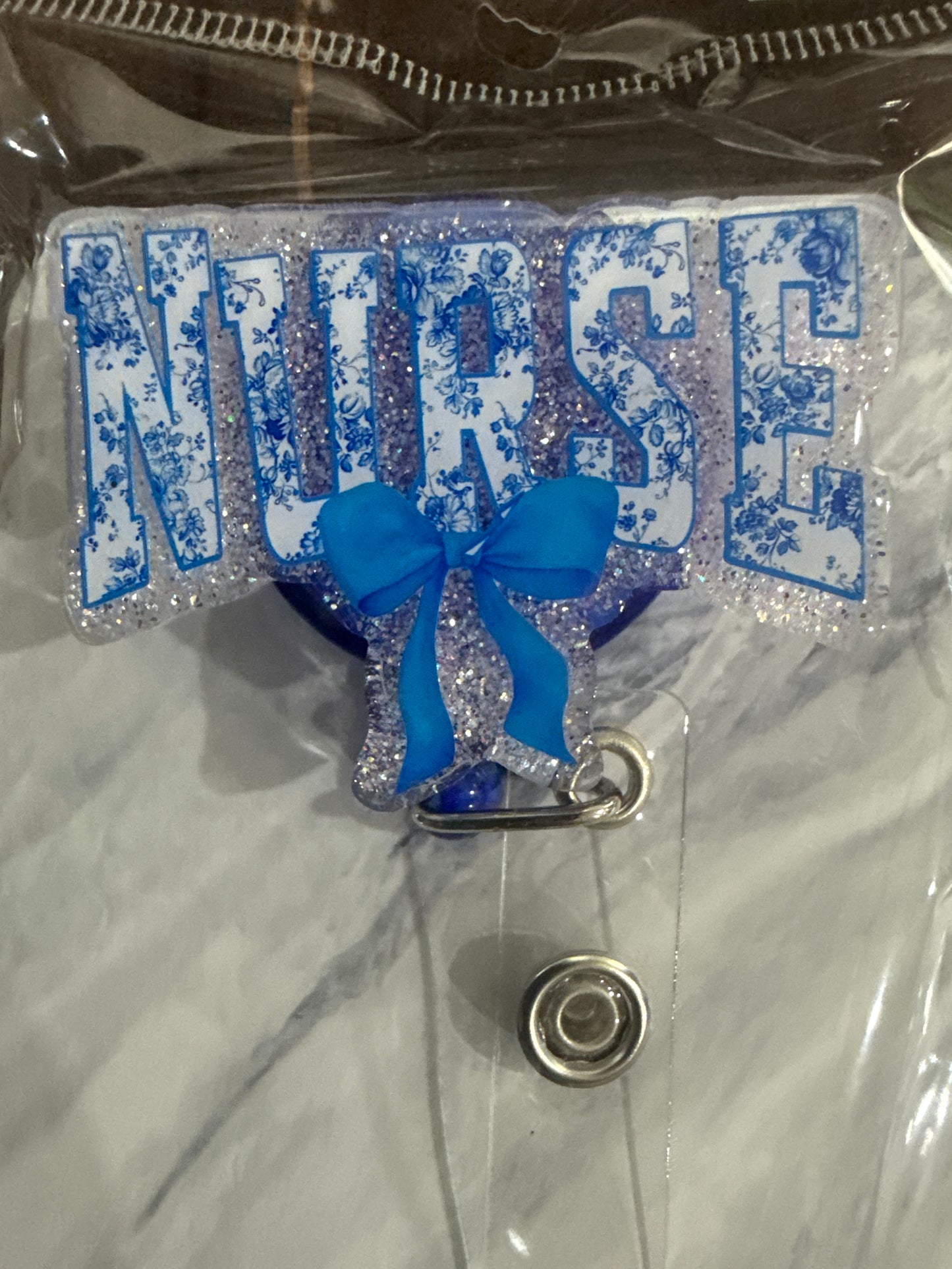 RTS - Blue "NURSE" with bow Badge Reel