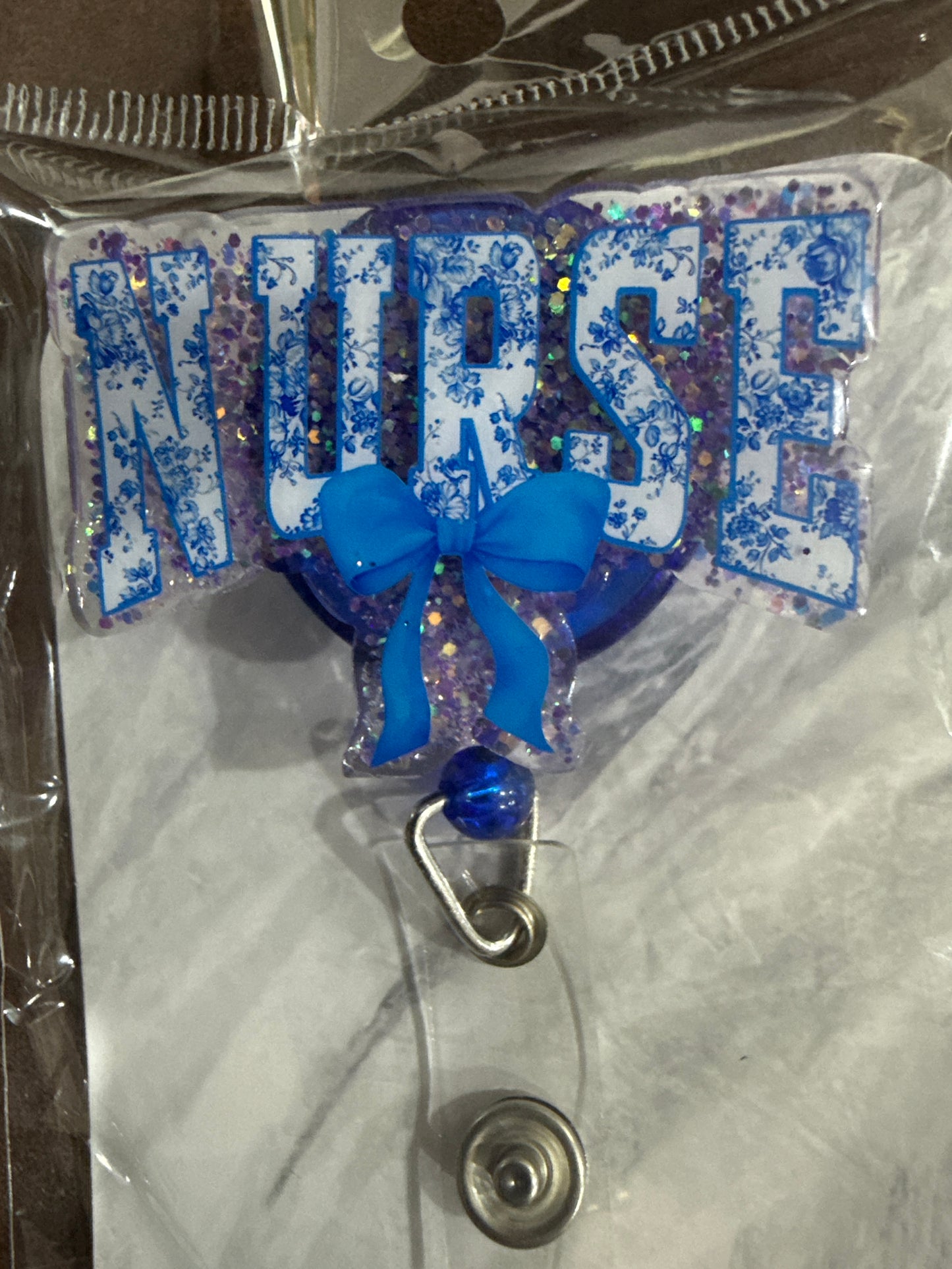 RTS - Blue "NURSE" with bow Badge Reel