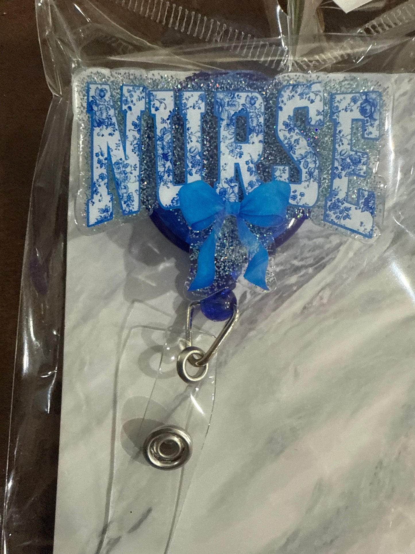 RTS - Blue "NURSE" with bow Badge Reel